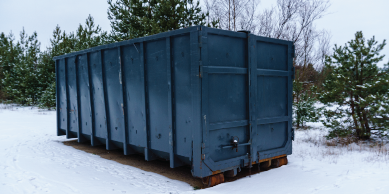 winter dumpster in snow