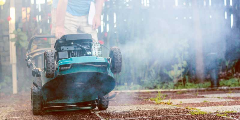 Broken push mower engine smoking