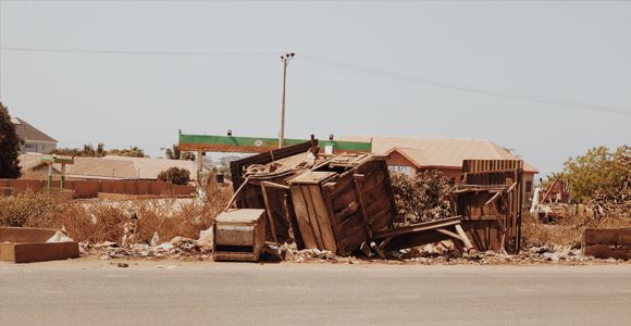 Broken wood and debris on the side of the road