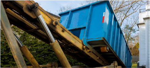 dumpster being picked up by truck