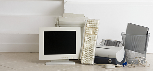 Pile of old computer, laptop, printer, and keyboard