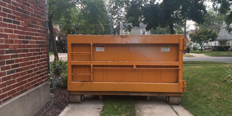 dumpster in driveway