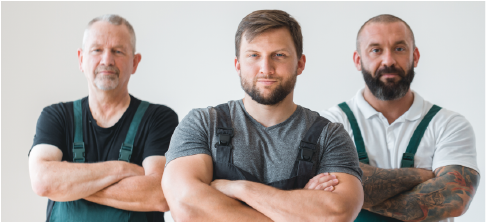 three junk removal crew members facing camera with arms crossed