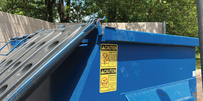 open blue commercial dumpster