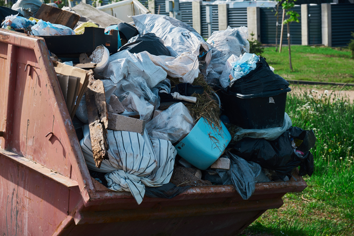 Dumpster full of old household junk