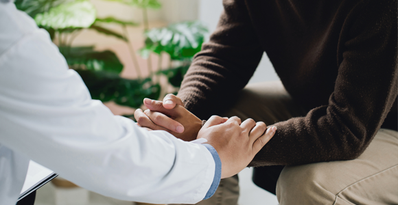 Therapist comforting patient