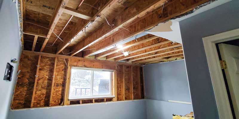 Wall and ceiling removed in bedroom