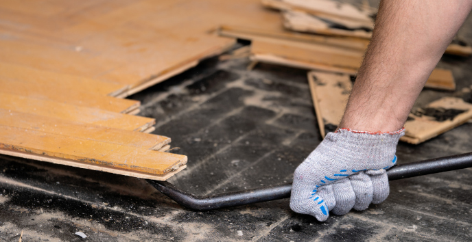 Removing a residential floor using a prybar