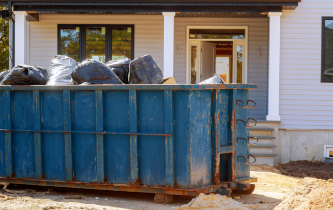 12 yard dumpster in front of house