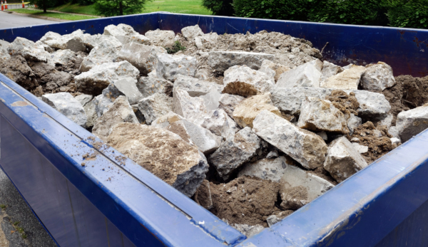 Dumpster filled with concrete debris