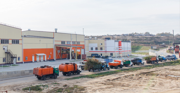 Line of cars and dump trucks at the landfill