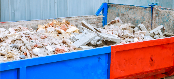 dumpster filled with bricks