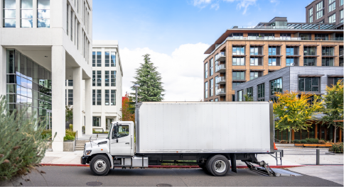 junk removal truck in city