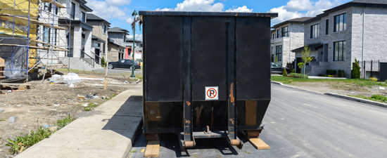 dumpster placed in a public street