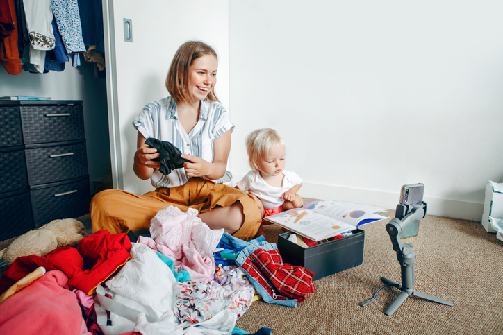 Mother organizing room with baby